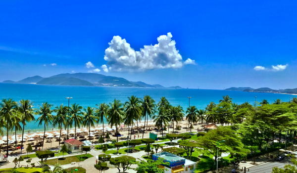 Looking over a small beach town towards the clear blue sea in Nha Trang